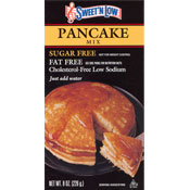Sweet'N Low Pancake Mix. Packaged in a small black and gold cardboard box.